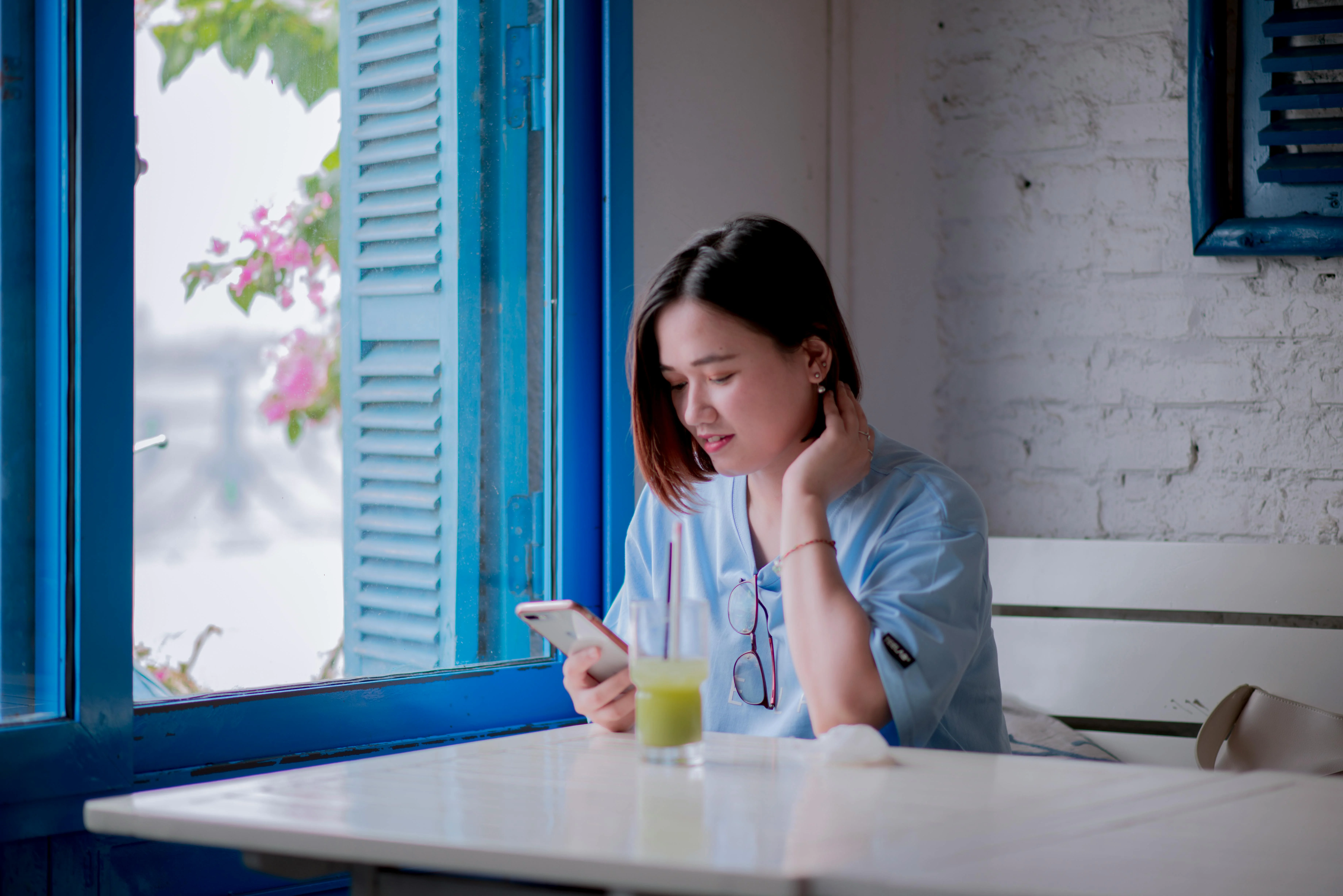 Person using smartphone at restaurant